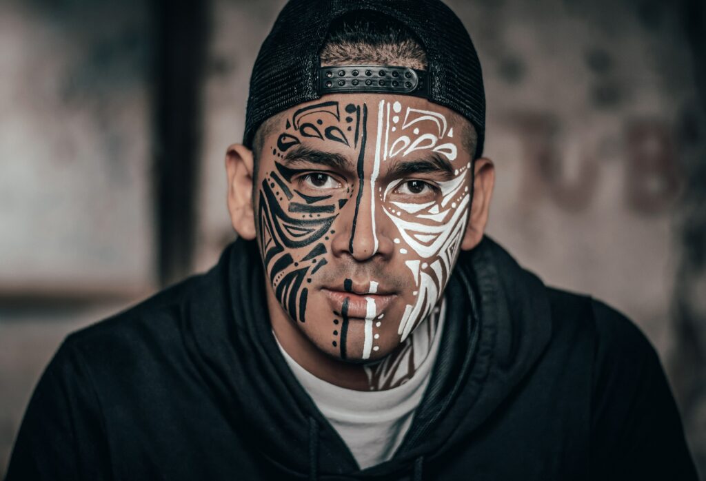A Man with tribal face paint. He has named his superpower and represents its good and evil with half is face black and the other half white. 