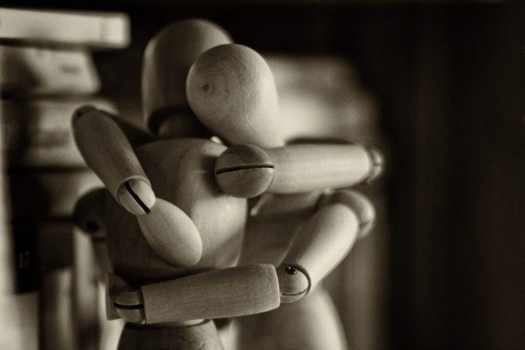 Do your loved ones know you care or are you too wooden in you love like these hugging figurines?