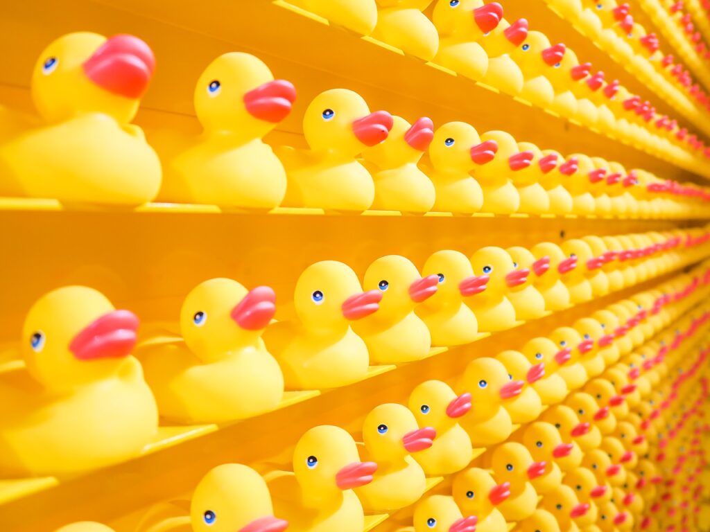 Rows and rows of yellow rubber duckies in total alignment