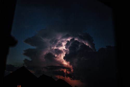 What is wrong with you? - an electrical storm in the brain displayed as a huge storm cloud in the dark of night.