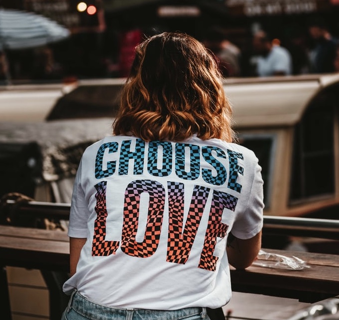 A woman with a t-shirt that says Choose Love across the back! Let love lead the way!