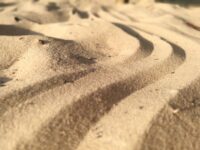 A wavy line drawn in the sand