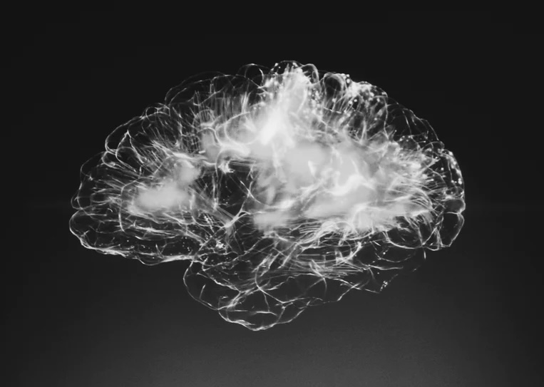 An image of a healthy brain lit up with the electric flow of neurons